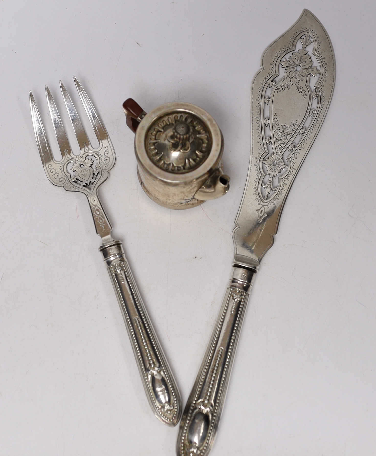 A pair of Victorian silver fish servers, Martin, Hall & Co, Sheffield, 1850, knife 33.1cm, together with a Japanese white metal miniature teapot, with bamboo decoration and lacquered handle.